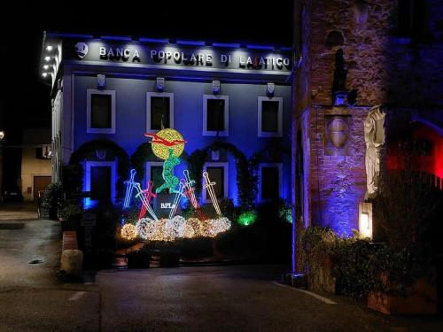 a building with christmas lights on the front of it at Lajatico Rentals - Terrazza sul Tramonto del Silenzio in Laiatico