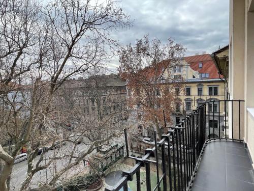 a balcony of a building with snow on the ground at Smart Hotel Budapest in Budapest