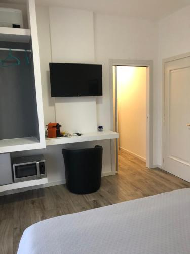 Televisyen dan/atau pusat hiburan di Relax & Emozioni Rooms
