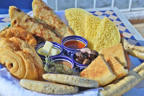 a basket filled with bread and various types of dips at Hotel Golden Star in Taounate