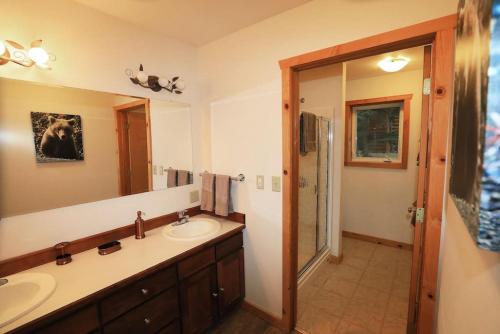 a bathroom with a sink and a mirror at 3 Bedroom Home with Amazing Views 11 mi from Denali in Healy