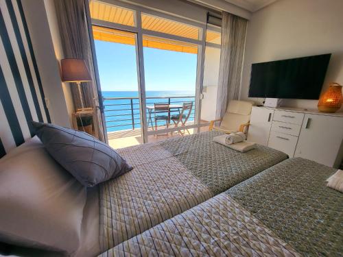 En eller flere senge i et værelse på El Espigón de Santa Clara