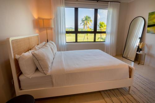 Ένα ή περισσότερα κρεβάτια σε δωμάτιο στο The Country Club Residences at Grand Reserve