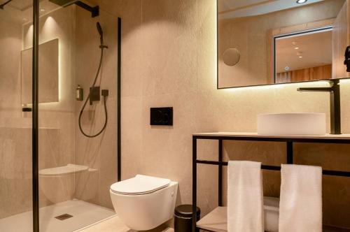 a bathroom with a toilet and a shower at The Valentia Corretgería in Valencia