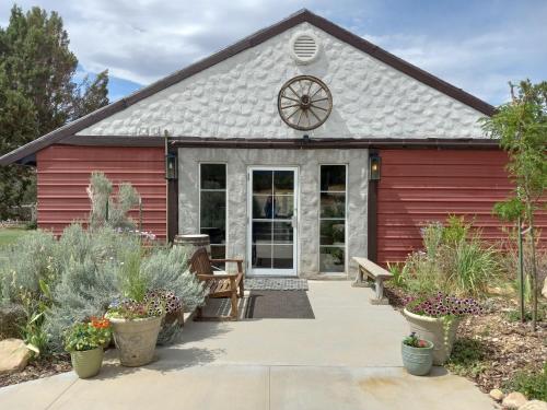 a red barn with a clock on the roof at The Joseph Studio at Wind Walker Homestead in Spring City