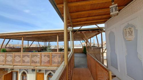 an image of a balcony of a house at Naqshband in Bukhara