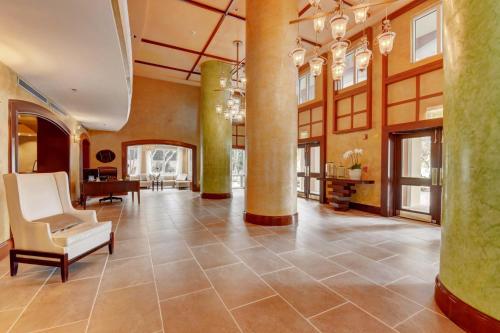 an empty lobby with a large room with columns at The Mutiny Luxury Suites Hotel in Miami