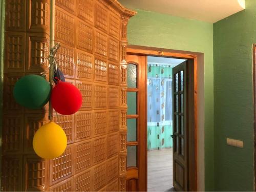 a room with a wall with colorful lights on it at Villa Verde in Cricova