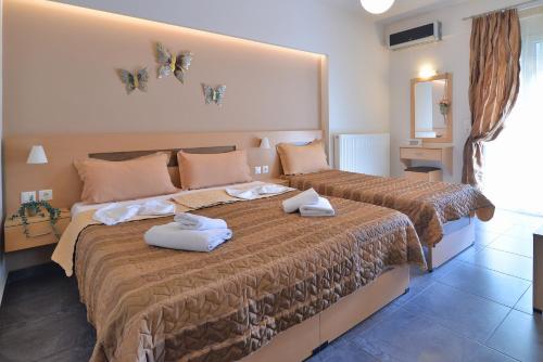 Cama o camas de una habitación en Aigli Rooms