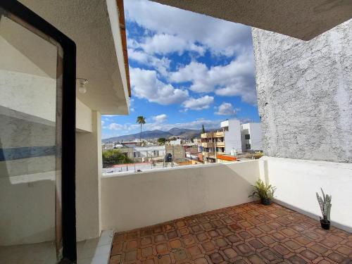 a balcony with a view of a city at Casa El Colibrí CEC in Tehuacán