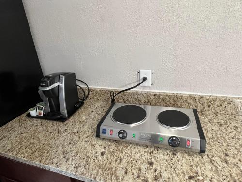 a router sitting on a counter next to a printer at Country Inn & Suites by Radisson, Mt Pleasant-Racine West, WI in Sturtevant