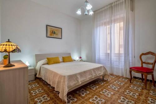 Posteľ alebo postele v izbe v ubytovaní Casa vacanze 100 metri dal mare