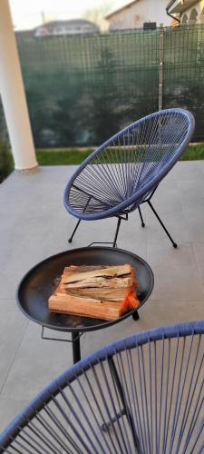 a grill with a plate of food on a table at Rental house in Dumbrăviţa