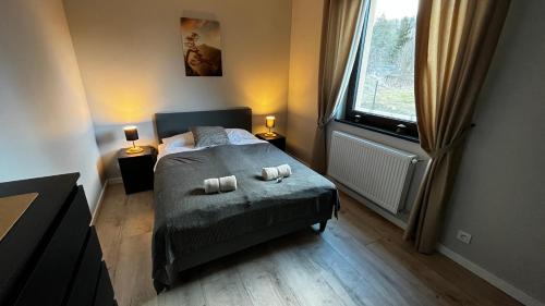 Posteľ alebo postele v izbe v ubytovaní Apartamenty Czarna Perła