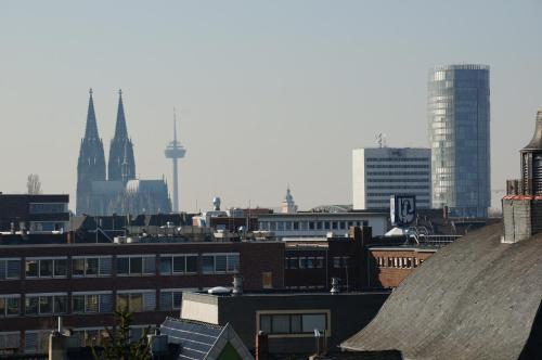 a view of a city with buildings and cathedral at Köln Deutz/Messe, Lanxess Arena in Cologne
