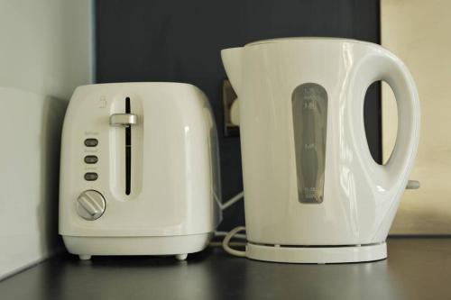 two white toasters sitting next to each other on a counter at No. 3 Bligh's Yard in Canterbury