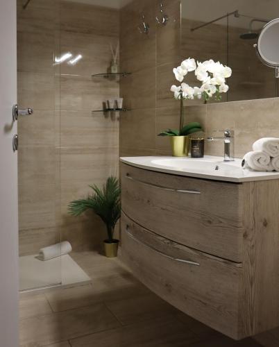 a bathroom with a sink and a shower at A Casa Tua in Bologna