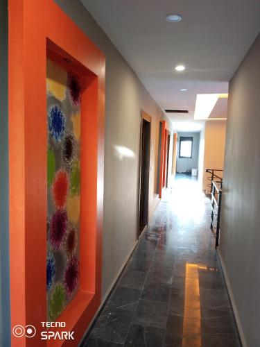 a hallway with colorful paintings on the wall at Mali Garden Residence in Side