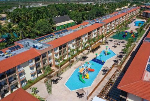 an overhead view of a resort with two pools at Apart Resort Beira Mar Mutá - PS in Porto Seguro