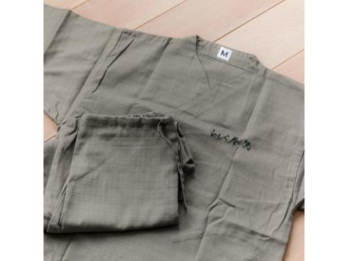 a pair of gray shorts sitting on the floor at Hotel Rashiku Kanazawa - Vacation STAY 49686v in Kanazawa
