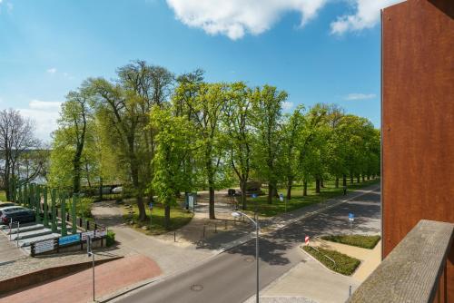 a view of a park from a building at Radlon Fahrrad-Komfort-Hotel in Waren