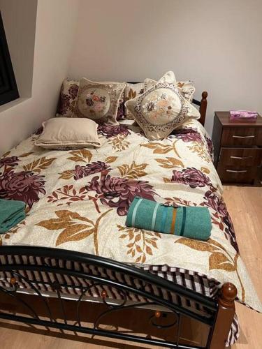 a bed with pillows on it in a bedroom at 010- Lovely one bedroom in Ealing F6 in Ealing