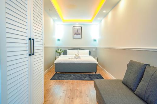 Postel nebo postele na pokoji v ubytování Cihangir VAV Suites
