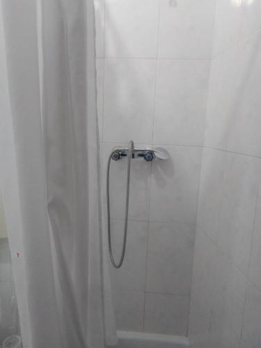 a shower with a shower curtain in a bathroom at Casa Aires Varela in Elvas