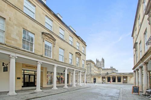 an empty street in a city with buildings at Roman Bath View in Bath