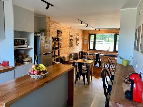 a kitchen with a table with a bowl of fruit on it at Albergo B&B in Panguipulli