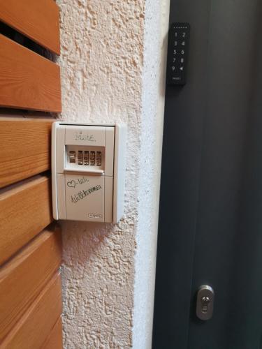 a microwave oven on the side of a wall at Modernes, Mini-Apartment Nürnberg,Playmobil in Zirndorf