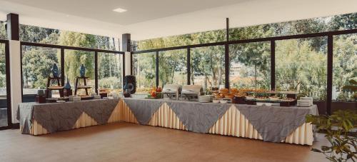 a large room with a table with food on it at Oro Verde Cuenca in Cuenca