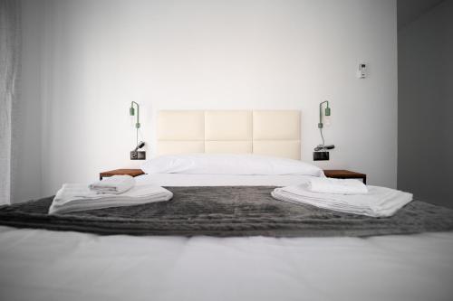 Postel nebo postele na pokoji v ubytování Apartamentos la Encarnacion