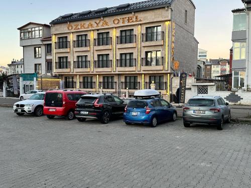 a group of cars parked in front of a building at Özkaya hotel in Sivas