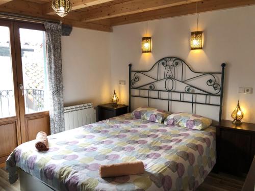 a bedroom with a large bed and a window at Old town Superbistak in Lekeitio