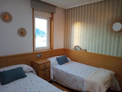 Postel nebo postele na pokoji v ubytování Apartamento en la playa