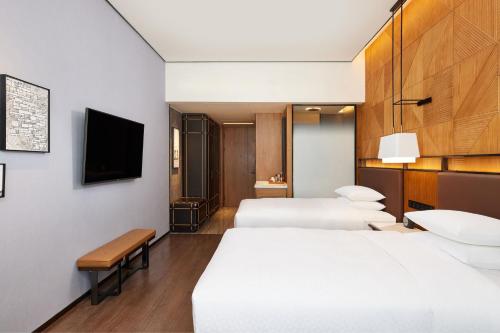 Ένα ή περισσότερα κρεβάτια σε δωμάτιο στο Four Points by Sheraton Yiyang