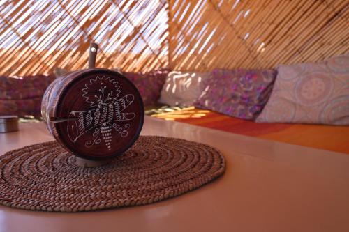 a cup sitting on top of a table at Hike and Chill Homestay in Tinerhir