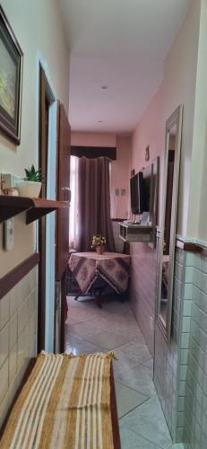a bathroom with a sink and a tub in a room at Apartamento Copacabana in Rio de Janeiro
