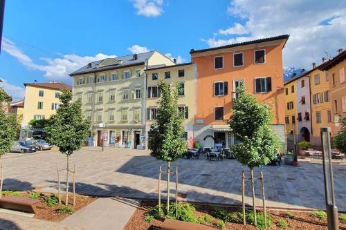 a group of trees in front of a building at Piccola Venezia - Borgo Valsugana in Borgo