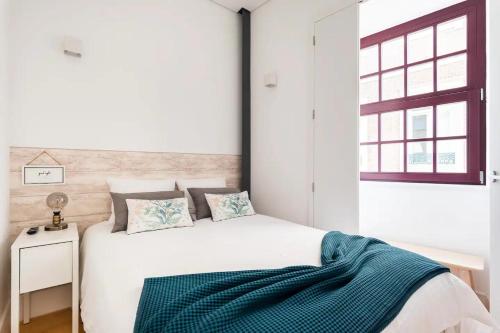 Postel nebo postele na pokoji v ubytování Neptuno Boutique Apartment - No coração do centro de Aveiro