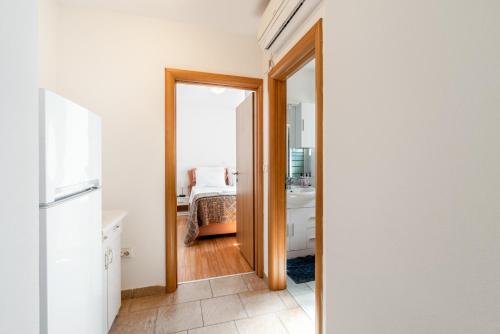 a hallway with a door leading to a bedroom at Apartments with a parking space Lopar, Rab - 14070 in Lopar