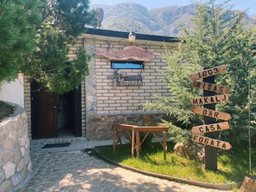 a sign in front of a brick building with street signs at Vive Libre Travel Club in Santiago