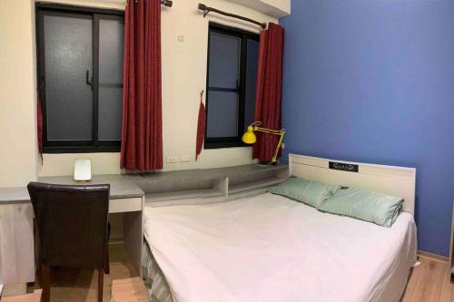 Ένα ή περισσότερα κρεβάτια σε δωμάτιο στο FengJia Pleasure Life 2