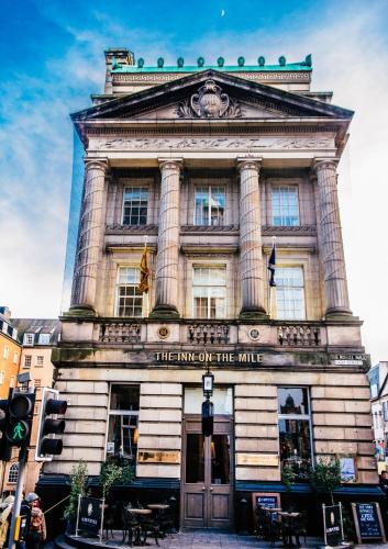 a building with a sign that reads the inn on the mile at The Inn on the Mile in Edinburgh