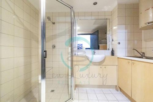 a bathroom with a shower and a sink at ZEN MARKETS - Boutique 1-BR Apt Near Parap Markets in Paraparap