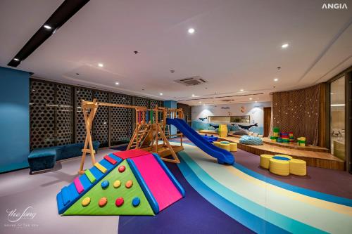 a play room with a slide and a playground at The Sóng Condotel in Vung Tau City - The Sóng Real Company in Vung Tau