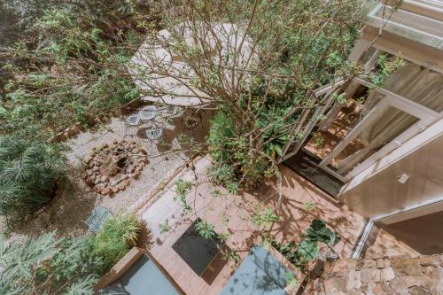 an overhead view of a garden with plants and a building at Dahlia Dalat in Xuan An