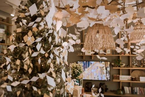 a christmas tree with white papers hanging from it at Dahlia Dalat in Xuan An