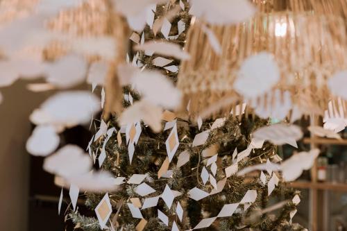 a christmas tree is decorated with white paper at Dahlia Dalat in Xuan An